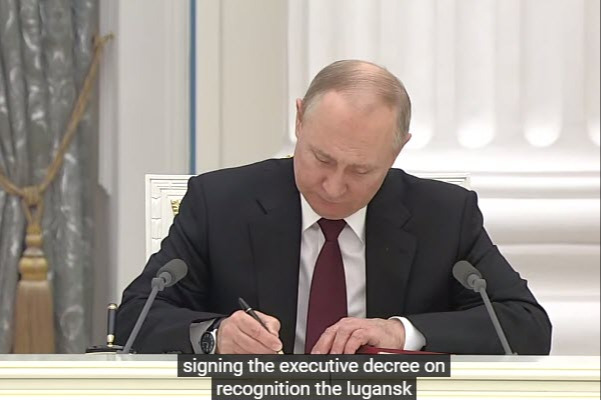 Putin signing documents
